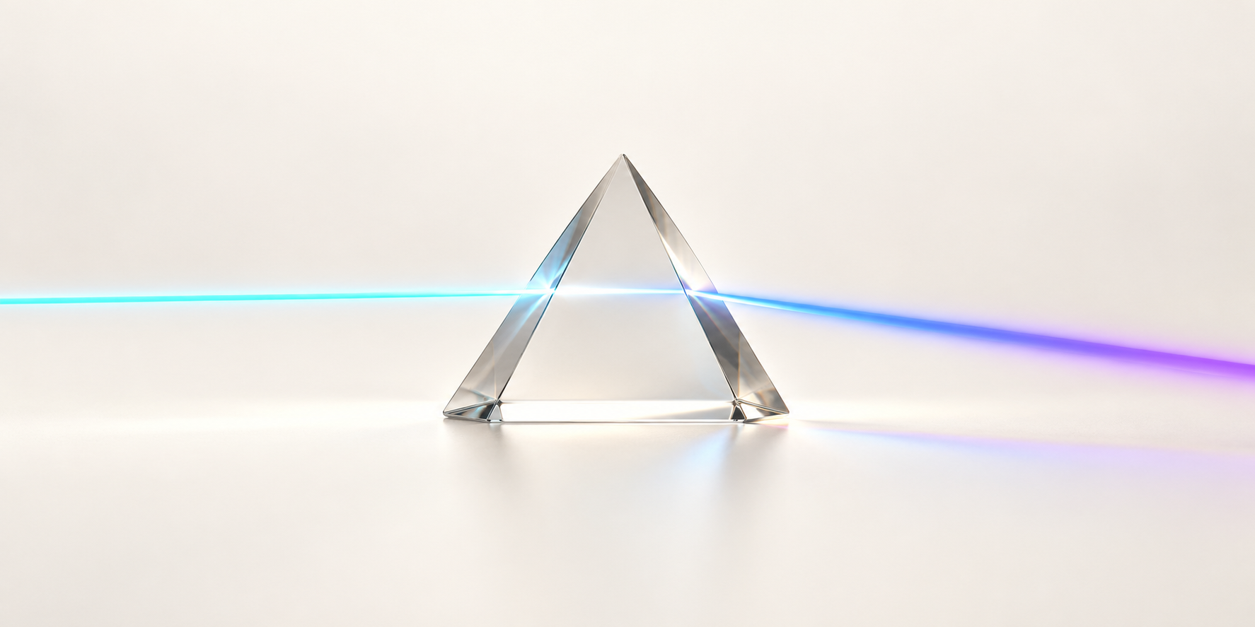 A cyan light beam passing through a clear prism